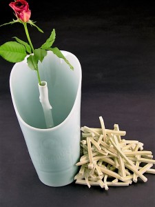 Harlan House. Windy Single Rose Vase With Fries. 2009. Vase form is slip cast with cobalt underglaze drawing and clear HH celadon over. Fries are handbuilt with Imperial Snapdragon Yellow glaze.