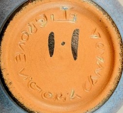 Jan Grove’s incised potter’s wheel and Helga Grove’s painted “H”, with “Victoria Canada”.