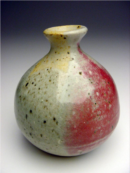 Dean Mullavey. nd. Small vase vase with asymmetrically formed lip. Copper red highlights. 3.5 inches tall by 2.75 inches wide .